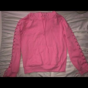 pink sweatshirt with ties up the arms